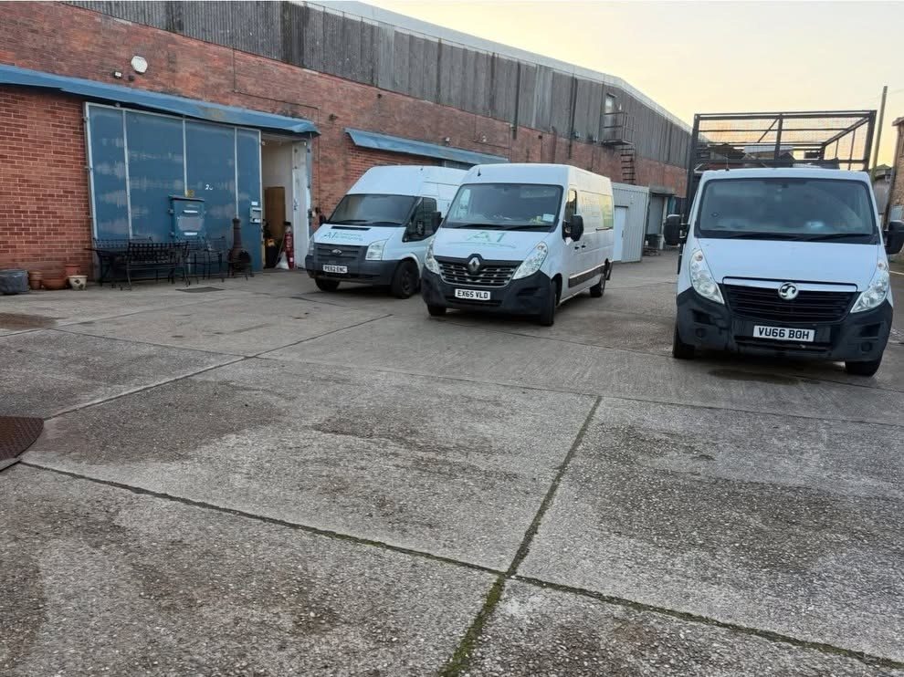 Three A1 Clearance and Recycling vans parked at the company yard at the end of the working day